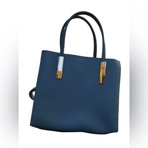 A stylish Sky Blue handbag Unknown brand with a snap gold closure NWOT